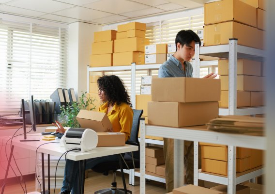 Team packing customer orders in a fulfilment office
