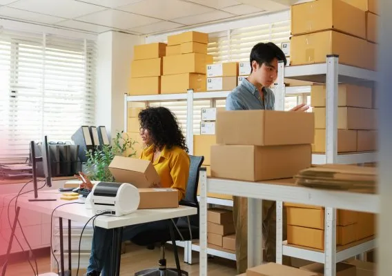 Team packing customer orders in a fulfilment office