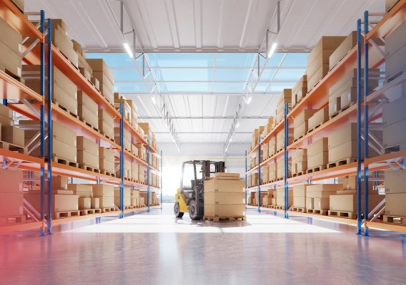 Warehouse aisle stacked with product cartons